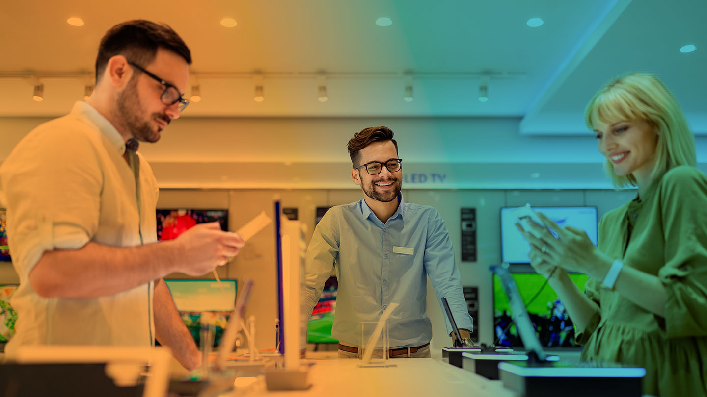 people shopping for phones in a wireless retail store